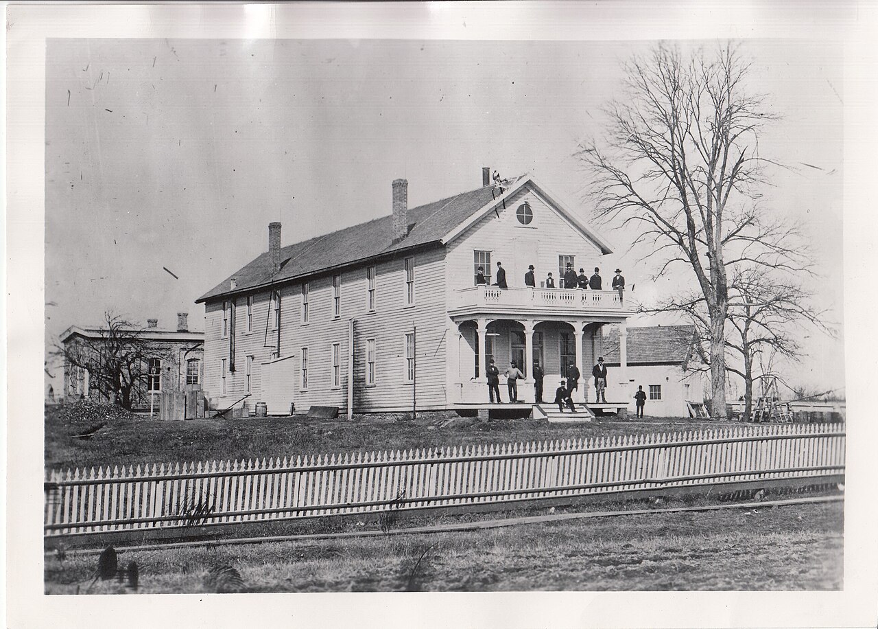 Edison's staff standing outside the main laboratory building at Menlo Park, New Jersey, around 1880